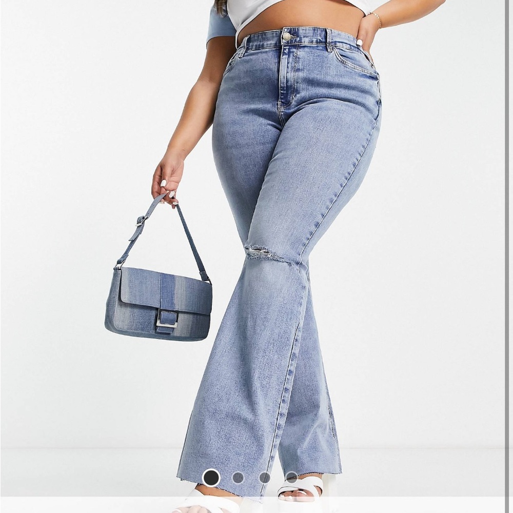 River island plus Amelie flair jean with rip in knee. Never worn new.